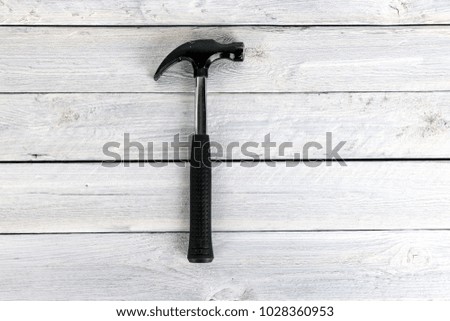 Stock picture of tools and screws on a wooden background