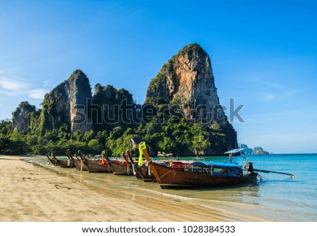 Amazing view of beautiful beach with longtale boats. Location: Railay beach, Krabi, Thailand, Andaman Sea. Artistic picture. Beauty world.