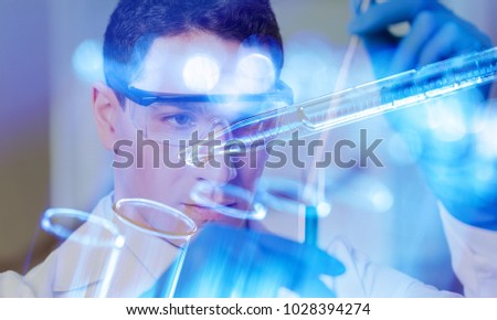 Scientist with test tubes