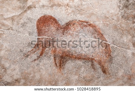An image of an ancient mammoth on a cave wall. Ancient people. the science. archeology.