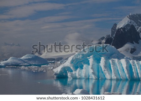 ice and iceberg floating on the water, antarctic peninsula, antarctica