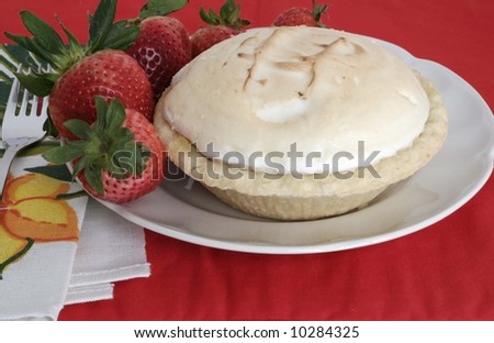 Lemon meringue pie and strawberries