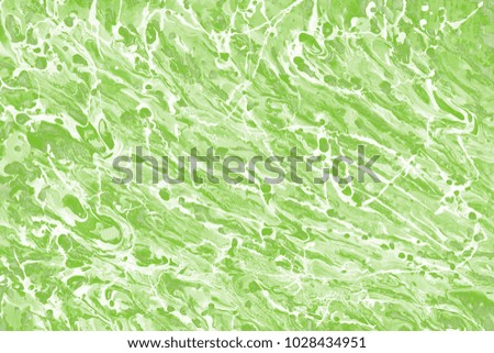 Green wet abstract paint leaks and splashes texture on white watercolor paper background. 