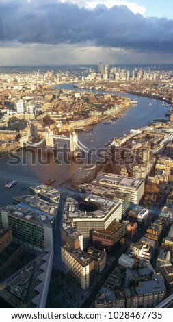 Aerial view of the city of London, UK, with River Thames, Tower Bridge and Canary Wharf