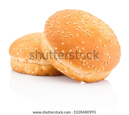 Two hamburger buns with sesame isolated on white background Royalty-Free Stock Photo #1028480995