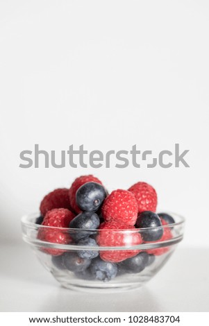 Mixed berries with blueberries and raspberries on a white background