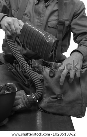 man actor in military uniform and gas mask soldiers of the Red Army period World War II
photo made in the style of "low key"