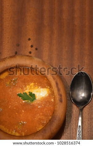Ukrainian borsch in a clay dish