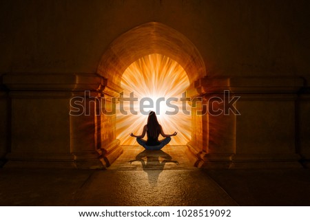 Woman doing yoga and meditation Royalty-Free Stock Photo #1028519092