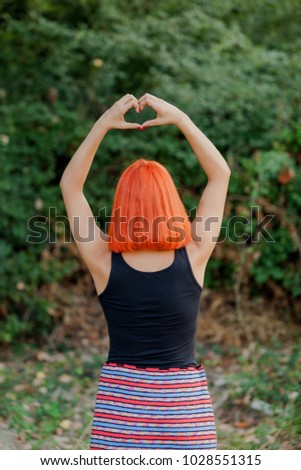 Girl making a heart shape symbol for love 