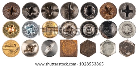 Screw heads, nuts, rivets. Isolated on white background. Top view. Royalty-Free Stock Photo #1028553865