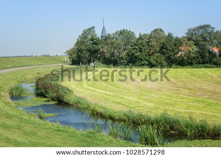 Church tower in a small village in the Frisian countryside in the Netherlands