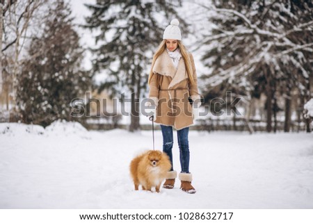 Woman with dog in winter