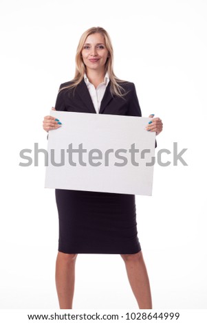 Blonde with long hair posing with a white plate for posting a logo, advertising. A photo on a white background for advertising. Different poses and emotions. Dressed in a business black suit, skirt
