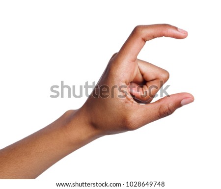 Black female hand measuring invisible items, woman's palm making gesture while showing small amount of something on white isolated background