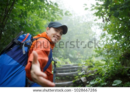 Photo of young man with outstretched hand