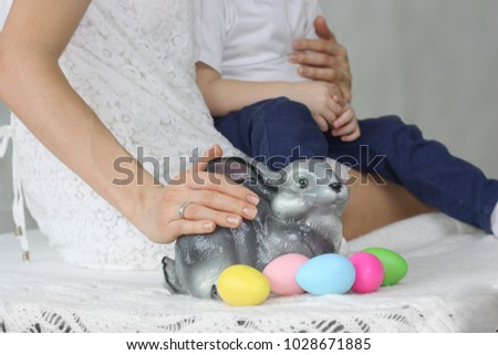 Easter. Easter bunny among eggs. symbol of happy easter on a white background. mom and baby