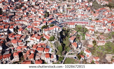 Aerial drone photo of iconic village of Arachova at winter and famous clock tower, Voiotia, Greece