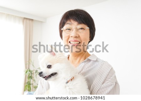 Aged woman buying a dog