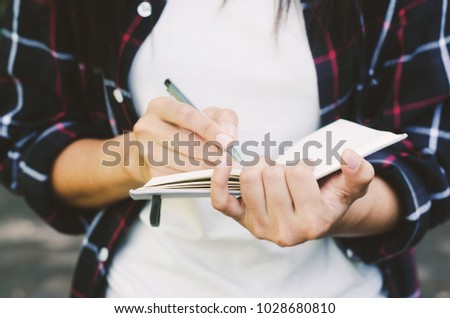 gorgeous woman hand use pen writing on notebook paper for memo.