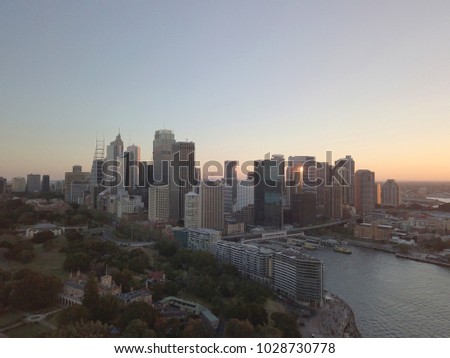 Aerial view of generic cityscape skyline at sunset, bird eye view of Sydney horbour city architecture in Australia