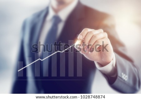 Businessman plan growth and increase of positive indicators in his business, Development and growth concept. Royalty-Free Stock Photo #1028748874