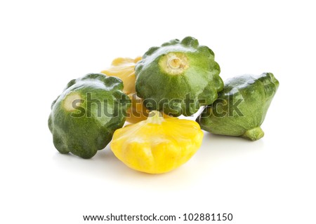 Group of green and yellow pattypan squashes