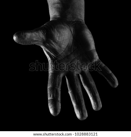 Black and white steel man's hands and gestures on a black background