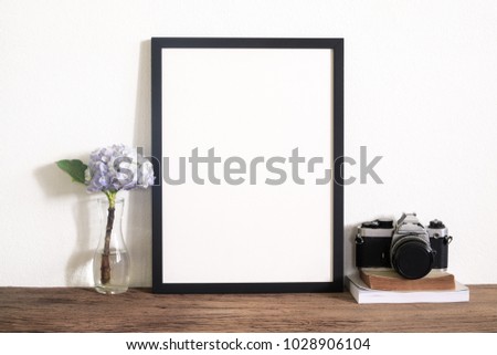 Mock up frame photo on wooden table. Lifestyle home decoration