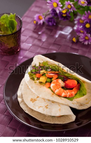 Shrimp with vegetables wrapped in a tortilla