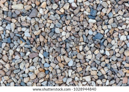 Stone pebbles texture background for interior exterior decoration and industrial construction concept design.