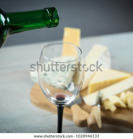  red wine and board of cheese