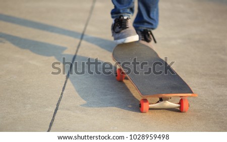 skateboarder legs skateboarding at skatepark
