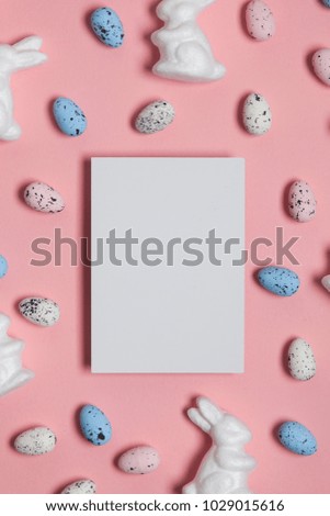 Easter holiday background with eggs, bunnies and a blank label sign