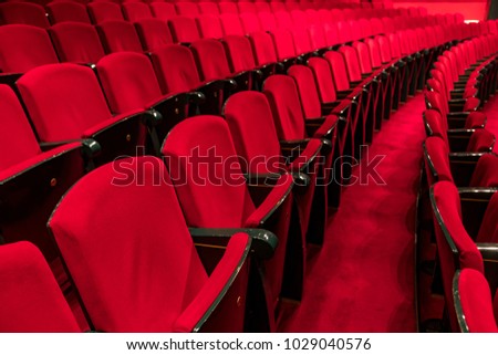 Red seats in a empty theater and opera Royalty-Free Stock Photo #1029040576