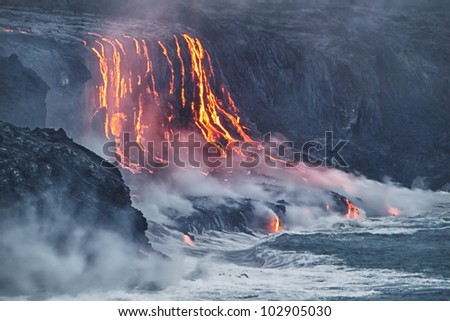 Lava erupting into Pacific Ocean in Hawaii Big Island Royalty-Free Stock Photo #102905030