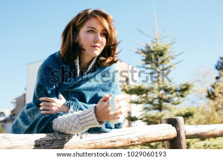 Beautiful Caucasian woman enjoying sunny day in mountain.