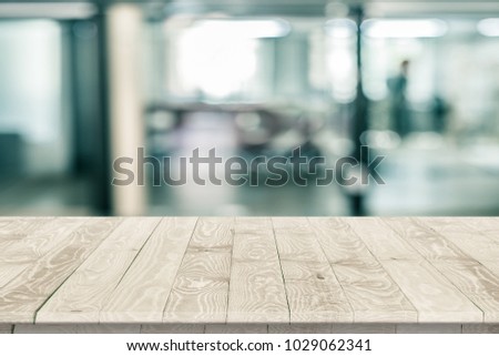 Empty wooden table perspective for product placement or montage with focus to table. Wooden board surface.