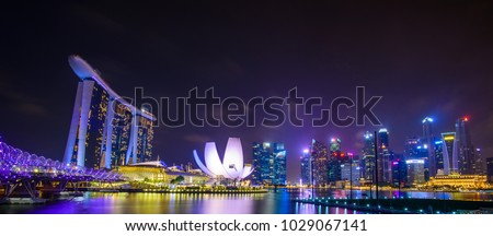 Singapore skyline with urban buildings over water Royalty-Free Stock Photo #1029067141
