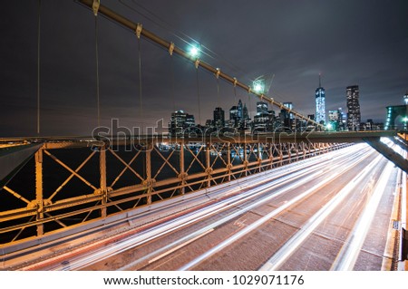 Long exposure photo on the Brooklyn Bridge at late night in New York City