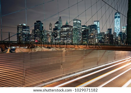 Long exposure photo on the Brooklyn Bridge at late night in New York City