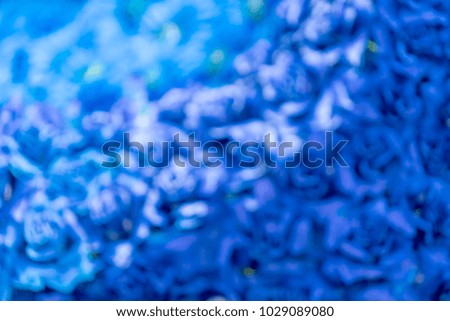Blurred of gerbera and roses flowers which are dyed in Blue color for decoration in blooming flora
