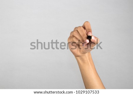 Hand holding a digital pen for click or select something on screen isolated with on white background.