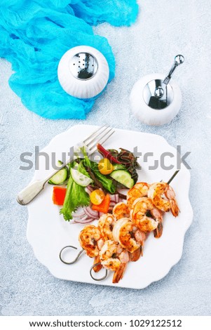fried shrimps with salad, fried shrimps on sticks, stock photo