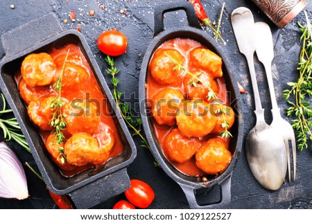 meatballs with tomato sauce in bowl, stock photo