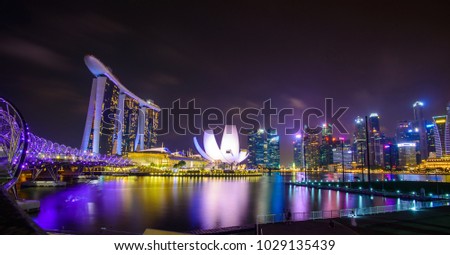 Singapore skyline with urban buildings over water Royalty-Free Stock Photo #1029135439
