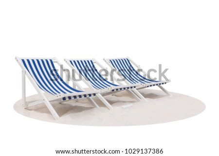 Three blue and white striped beach chair on the sand beach isolated on white background