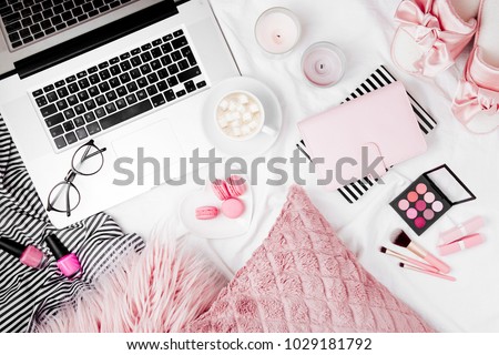 Fashion blogger workspace with laptop and woman accessory in bed. flat lay,  top view Royalty-Free Stock Photo #1029181792