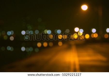 defocused park with beautiful city lights background.