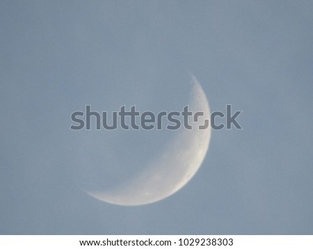 moon in the ascending phase occupying the central portion of the picture, under a clear blue sky misty, sp, Brazil